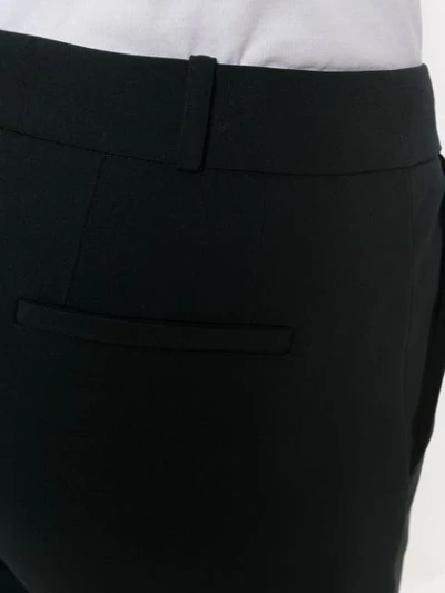 Shop Kiltie Flared Trousers In Black