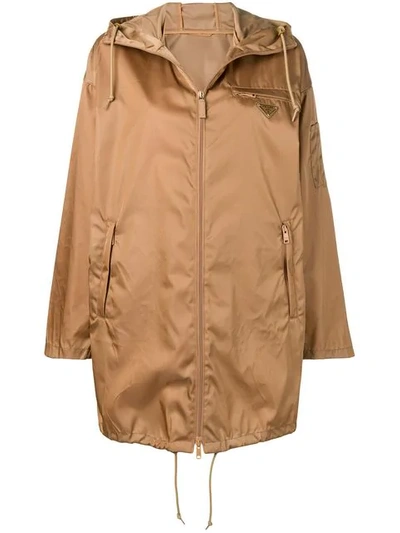 Shop Prada Logo Raincoat In Brown
