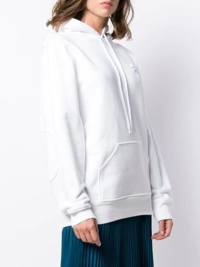 Shop Courrèges Oversized Logo Hoodie In White