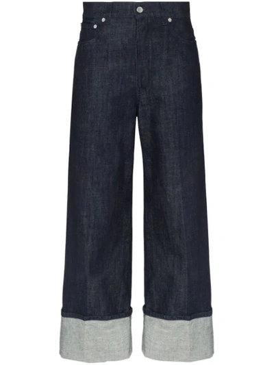 Shop Jw Anderson Turned-cuff Wide-leg Jeans In Blue