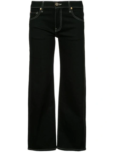 Shop Khaite Flared Cropped Jeans - Black