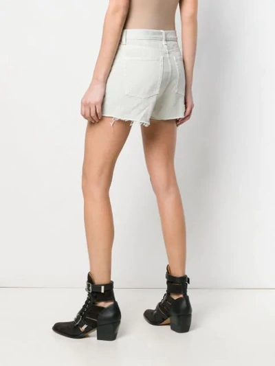 Shop Saint Laurent Distressed Denim Shorts In White
