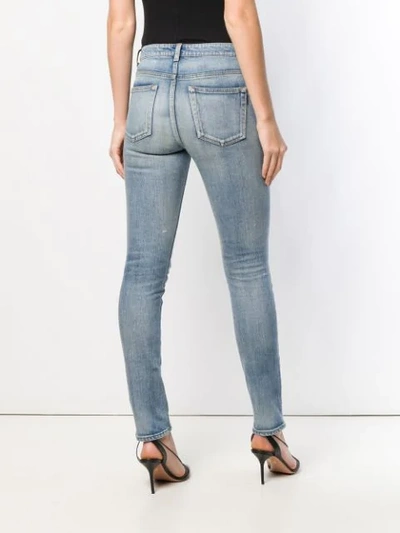 Shop Saint Laurent Distressed Skinny Jeans In Blue