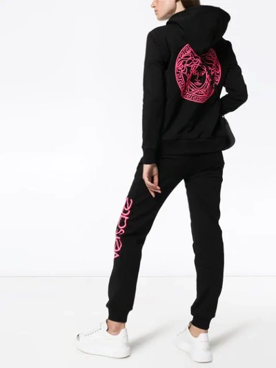 Shop Versace Logo Print Track Pants In Black