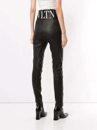 Shop Valentino Vltn Slim Leather Trousers In Black