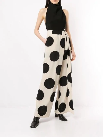 Shop Petar Petrov Polka-dot Flared Trousers In White