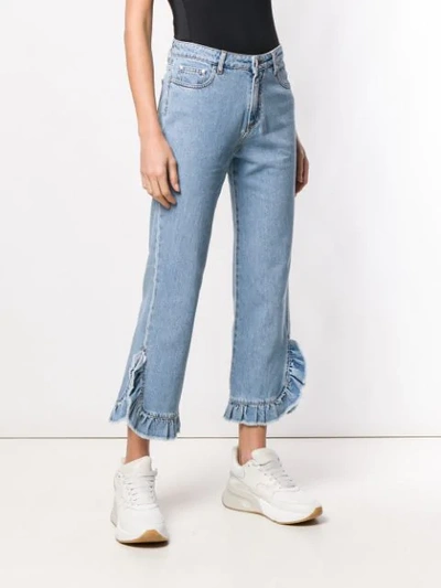 Shop Msgm Ruffle Trim Jeans In Blue