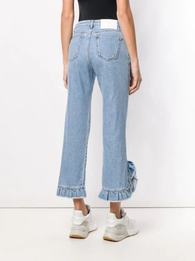 Shop Msgm Ruffle Trim Jeans In Blue