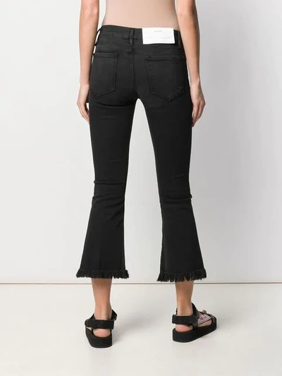 Shop Frame Cropped Flared Jeans In Black
