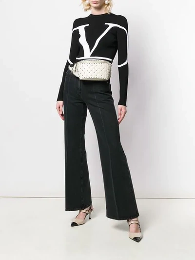 Shop Valentino Vlogo Flared Jeans In Black