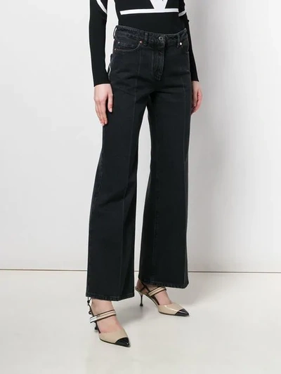 VALENTINO CONTRAST LOGO PRINT FLARED JEANS - 黑色