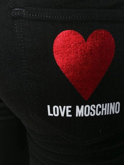 Shop Love Moschino Logo Print Cropped Jeans In Black