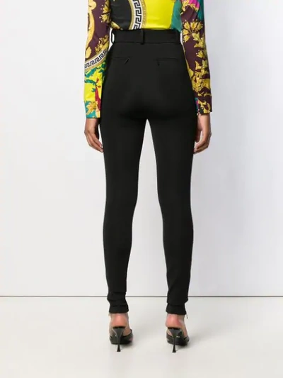 Shop Versace High-waist Skinny Trousers In Black