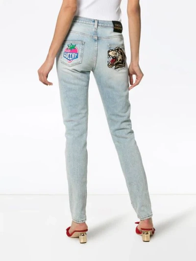 Shop Gucci Embroidered Strawberry Leopard Skinny Jeans In Blue