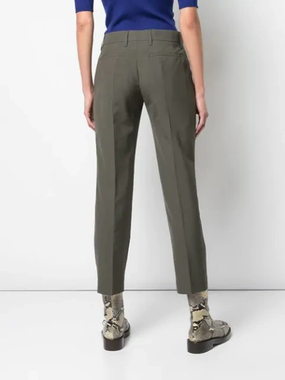 Shop Prada Cropped Pleated Trousers In Olive