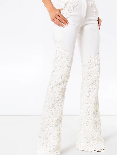 Shop Ronald Van Der Kemp Lace Appliqué Flared Jeans In White