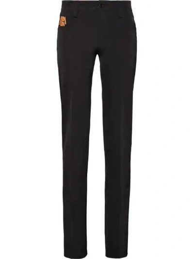 Shop Prada Stretch Technical Fabric Trousers In Black