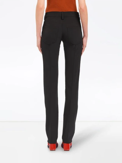 Shop Prada Stretch Technical Fabric Trousers In Black