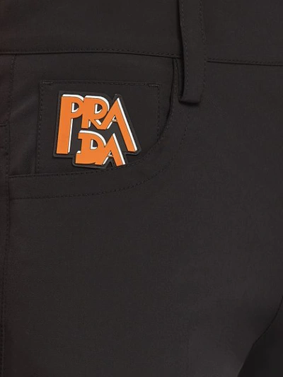 Shop Prada Stretch Technical Fabric Trousers In Black