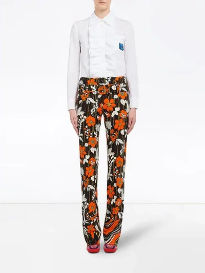 Shop Prada Printed Jersey Trousers In Orange