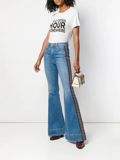 Shop Alice And Olivia Embroidered Stripe Flared Jeans In Blue