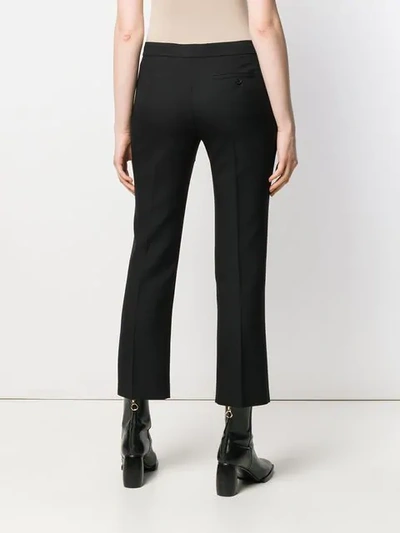 Shop Alexander Mcqueen Split Hem Trousers In Black