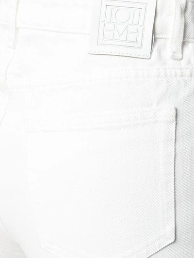 Shop Totême Flair Jeans In White