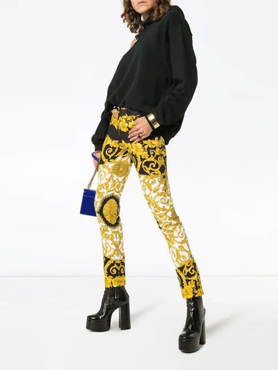 Shop Versace Baroque Low-rise Patterned Skinny Jeans In Black