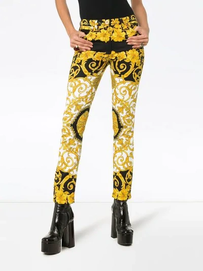 Shop Versace Baroque Low-rise Patterned Skinny Jeans In Black