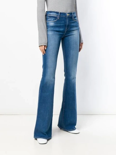 Shop Frame Washed Bootcut Jeans In Blue