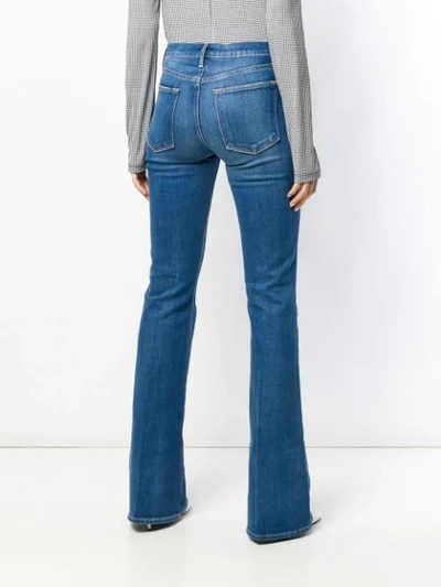 Shop Frame Washed Bootcut Jeans In Blue