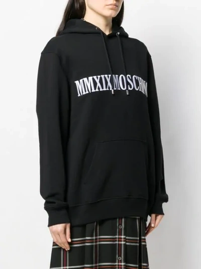 Shop Moschino Logo Embroidered Hoodie In Black