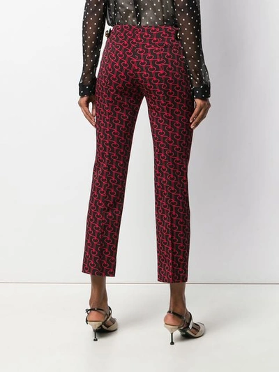 Shop Prada Key Motif Trousers In F0ta1 Black/red/black