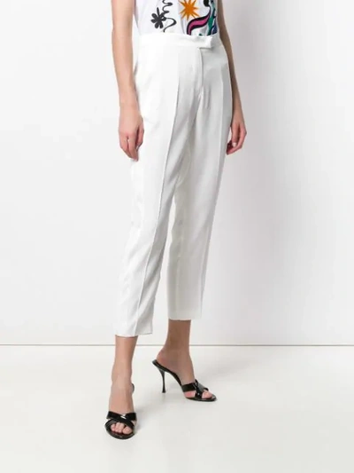 Shop Leqarant Tapered Trousers In White