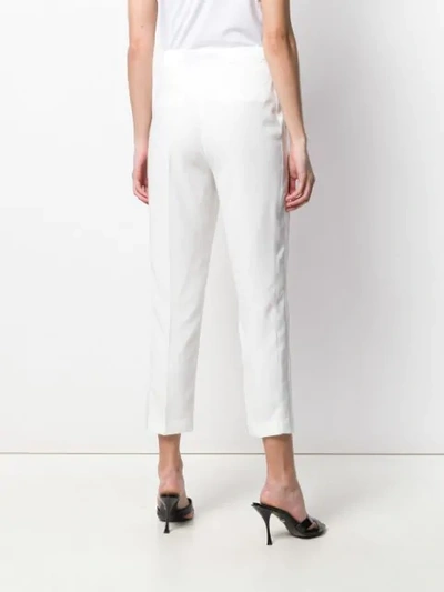 Shop Leqarant Tapered Trousers In White