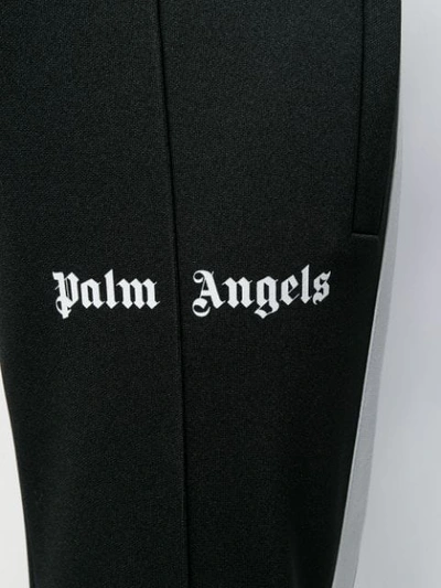 Shop Palm Angels Flared Track Pants - Black