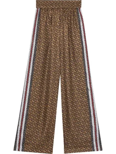 Shop Burberry Monogram Print Trousers In Brown