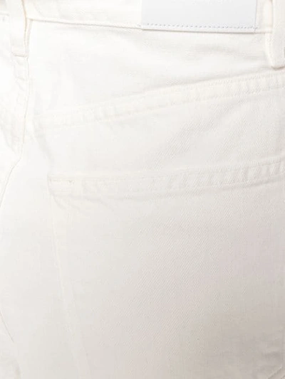 Shop Goldsign Super Flared Jeans In White