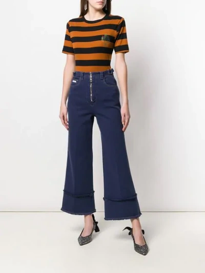 Shop Miu Miu Frayed Details Flared Jeans In Blue