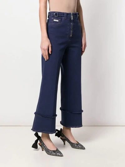 Shop Miu Miu Frayed Details Flared Jeans In Blue