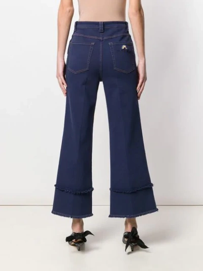 Shop Miu Miu Frayed Details Flared Jeans In Blue