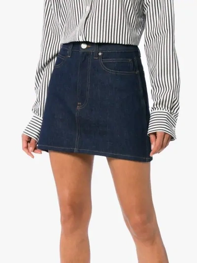 Shop Calvin Klein Jeans Est.1978 Logo Back Denim Mini Skirt In 102 Blue