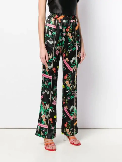 Shop Pinko Floral Print Trousers In Black