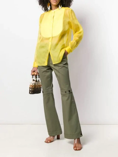 Shop Loewe Flared Trousers In Green