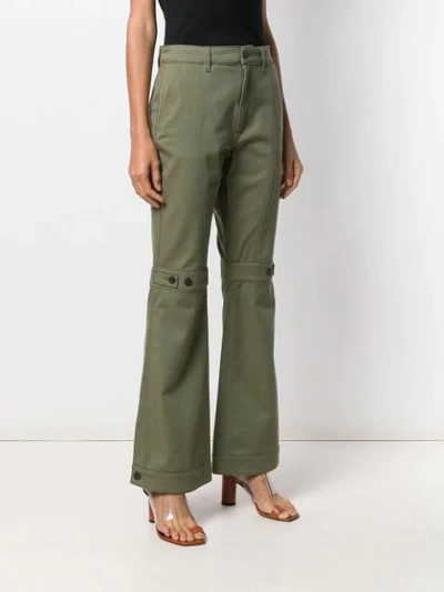 Shop Loewe Flared Trousers In Green