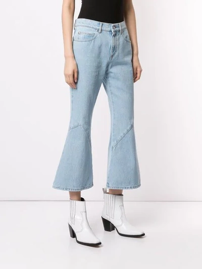 Shop Msgm Anchor Kick Flare Jeans In Blue