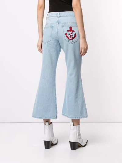 Shop Msgm Anchor Kick Flare Jeans In Blue