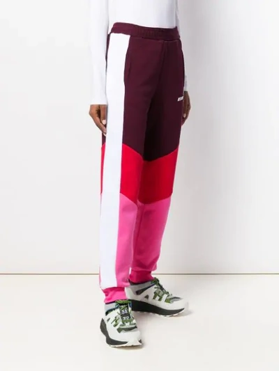 Shop Msgm Colour Block Track Pants In Red