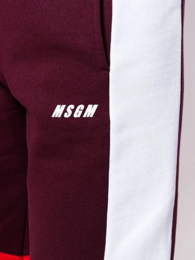 Shop Msgm Colour Block Track Pants In Red