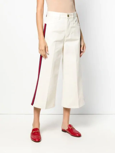 Shop Gucci Web Trim Cropped Jeans In Neutrals